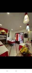 a dining room with tables and chairs and a room with tablesktop at vecchio west in Agerola