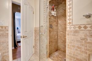 a bathroom with a shower with a glass door at Studio with Hot Tub Access, 4 Mi to SoFi Stadium in Los Angeles +25 photos