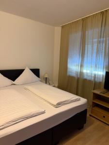 Giường trong phòng chung tại Hotel Ochsen