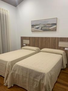 Ένα ή περισσότερα κρεβάτια σε δωμάτιο στο VillaLola