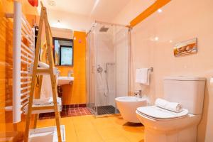 a bathroom with a shower and a toilet and a sink at Catania Crossing B&B - Rooms & Comforts in Catania +70 photos
