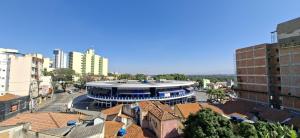 a view of a building in a city with buildings at Hotel Rio Branco in Aparecida