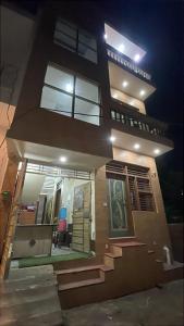 a house at night with the lights on at Govind dham in Vrindāvan