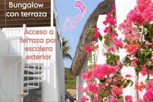 a building with pink flowers in front of it at Mandala Bungalows - Adults Only in Los Caños de Meca
