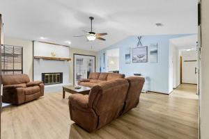 a living room with a couch and a fireplace at Sunnyside Retreat, Private pool, Bluewater Bay, Sleeps 11, Fenced Yard in Niceville