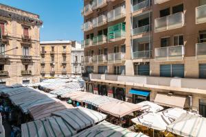 a group of stalls in front of a building at Catania Crossing B&B - Rooms & Comforts in Catania