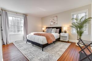 a bedroom with a large bed and a window at Zook Manor with Hot tub Firepit and Game Room in Atglen