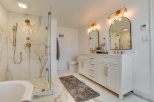 a white bathroom with a shower and a sink at Zook Manor with Hot tub Firepit and Game Room in Atglen +38 photos