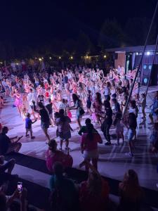 a large crowd of people dancing on a stage at night at Apartment Premier Fort Beach hotel F1 420 in Sveti Vlas +34 photos