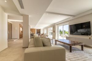 a living room with a couch and a table at Villa Amaranta in La Spezia