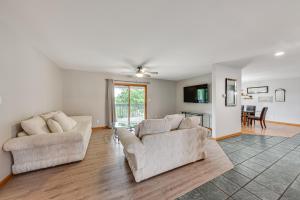 a living room with two couches and a table at Lake Mary View Pickleball Paradise Penthouse Unit in Twin Lakes