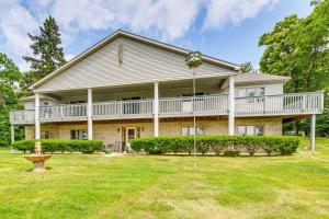 a large house with a porch and a yard at Lake Mary View Pickleball Paradise Penthouse Unit in Twin Lakes