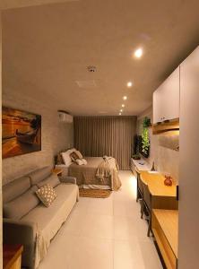 a living room with a couch and a bed at Kauai Beach Residence in Tamandaré +77 photos