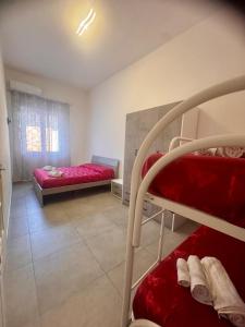 a room with a bunk bed and a bedroom with a window at Sarno La Vecchia Cascina in Sarno