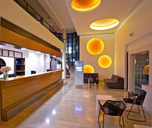 a lobby with yellow circles on the wall at Arena Verudela Beach in Pula