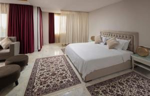 Postel nebo postele na pokoji v ubytování Verdi Tunis Beach Resort
