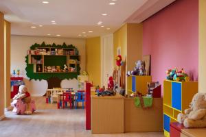 a room filled with lots of different types of toys at Mediterranean Beach Hotel in Limassol