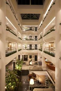 an image of a lobby with plants at Mediterranean Beach Hotel in Limassol