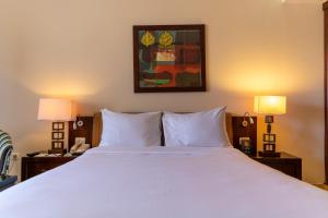 Łóżko lub łóżka w pokoju w obiekcie Swiss Inn Resort Hurghada