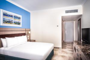 Telewizja i/lub zestaw kina domowego w obiekcie Swiss Inn Resort Hurghada