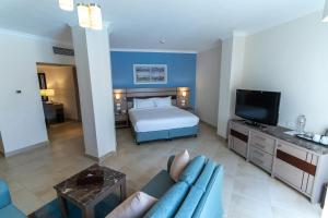 Telewizja i/lub zestaw kina domowego w obiekcie Swiss Inn Resort Hurghada