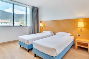 Postel nebo postele na pokoji v ubytování B&B HOTEL Bergamo Executive