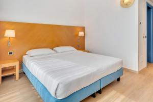 Postel nebo postele na pokoji v ubytování B&B HOTEL Bergamo Executive