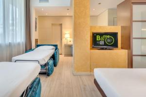 Postel nebo postele na pokoji v ubytování B&B HOTEL Bergamo Executive