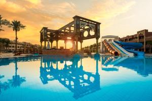 a swimming pool with a slide in a resort at Sunny Days El Palacio Resort & Spa in Hurghada