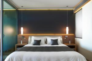 Posteľ alebo postele v izbe v ubytovaní Blue Dolphin Hotel