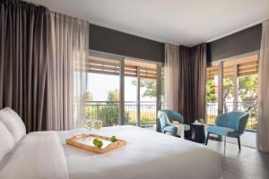 Posteľ alebo postele v izbe v ubytovaní Blue Dolphin Hotel