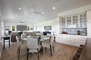 a kitchen and dining room with a table and chairs at Haupu Hale at Poipu in Koloa