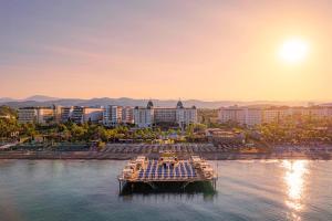 a group of boats in the water in a city at Sidera Kirman Premium - Ultra All Inclusive in Okurcalar