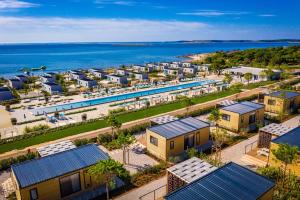an aerial view of a resort next to the ocean at Arena Grand Kazela Camping Homes in Medulin +37 photos