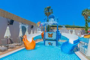 a water park with two slides in a pool at Q Ella Beach Hotel in Side