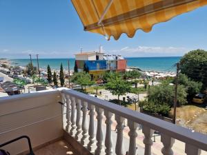 a balcony with a view of the ocean at Top Rooms in Paralia Katerinis