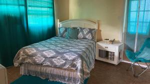 Кровать или кровати в номере Tropical Westend Oasis