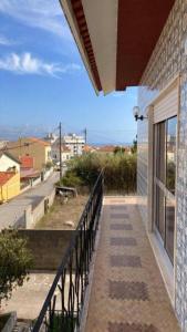 a balcony of a house with a view of a street at Casinha do mar in Buarcos