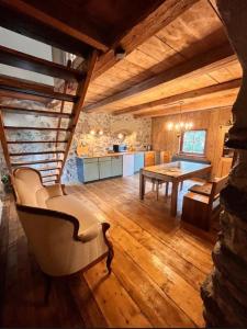a living room with a table and a dining room at Urlaub in der Burg am Bodensee in Kressbronn am Bodensee