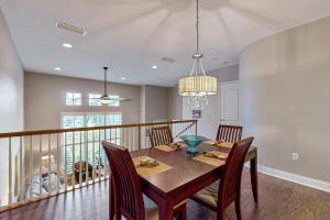 a dining room with a wooden table and chairs at Belle Harbor 13 in Clearwater Beach