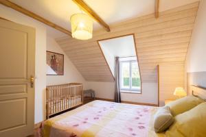 Postel nebo postele na pokoji v ubytování Le Jardin De Léonie