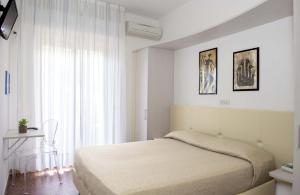 Postel nebo postele na pokoji v ubytování Hotel Anfora