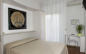 Postel nebo postele na pokoji v ubytování Hotel Anfora