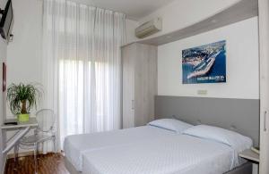 Postel nebo postele na pokoji v ubytování Hotel Anfora