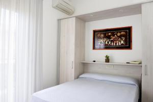 Postel nebo postele na pokoji v ubytování Hotel Anfora