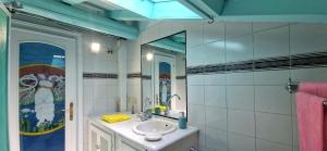 a bathroom with a sink and a mirror at Terrazza sul Mare in Lido di Camaiore +31 photos