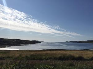 a view of a body of water with a cloudy sky at Caroy Bay Cottage-Uk32669 in Harlosh