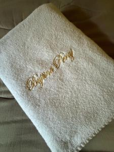 a white napkin with the words happy birthday on it at Peraj Guesthouse in Vermosh