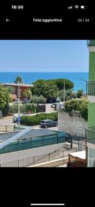 a view of a train station with the ocean in the background at Dany's Home Venus in Giovinazzo