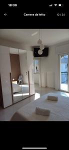 a bedroom with a bed with two pillows on it at Dany's Home Venus in Giovinazzo